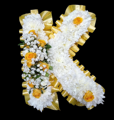 Single Letter Floral Tribute - A personalised single letter funeral tribute in classic white, finished with golden yellow detailing and coordinating ribbon.
